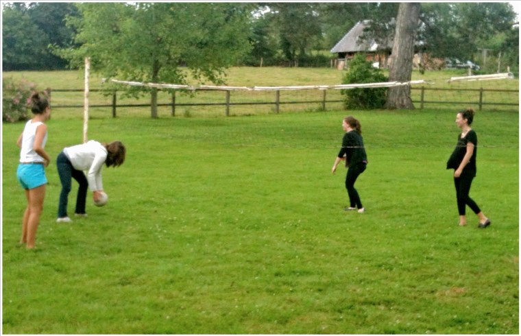 Celeste, Melinda, Ella & Chloe* attempt a volleyball game in the Bertail backyard.