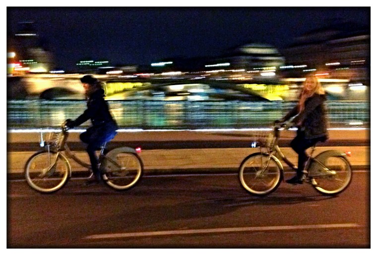 Oh, what fun it is for Melinda and Chloe to ride bikes over the Seine just past midnight on Christmas!