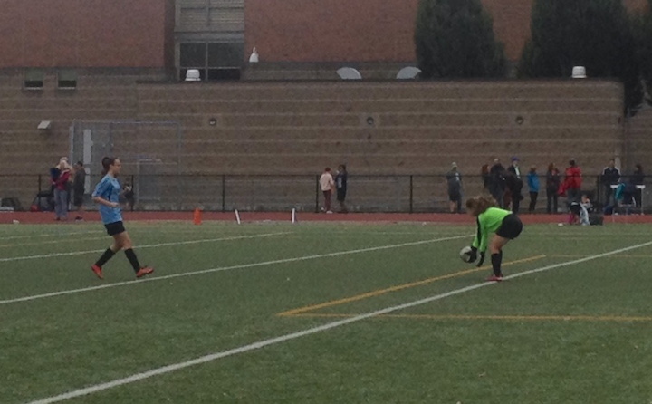 There's Celeste (in blue) getting warmed up before her first soccer game. Her team lost 1-0, but Celeste played great. She got a nice cheer from her teammates and their parents as she jogged off the field, a huge grin on her face. 
