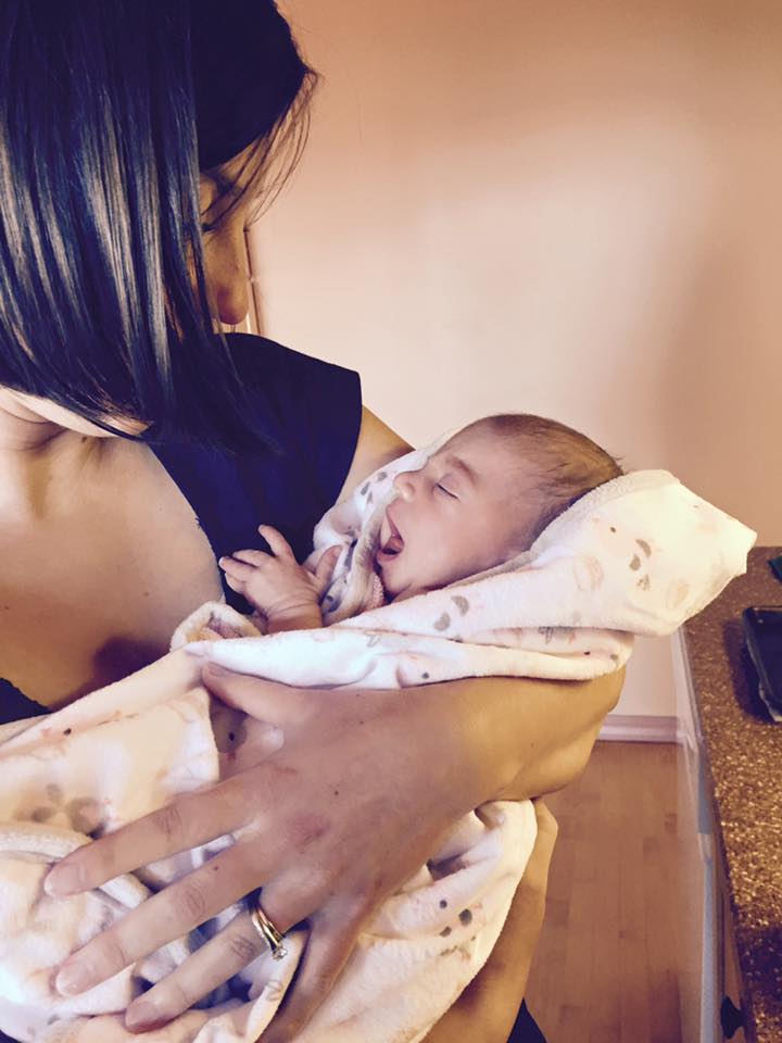 Here is a great picture of niece Jessica with her baby daughter Carina. I've been thinking a lot about Carina lately because I've spent considerable time making her the all-important mixed tape in honor of her birth. Next up, I have to write why I chose the songs. Stay tuned!