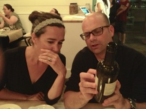 Bernard showing the bottle to Christine